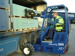 Shunty unloading sheetrock / wallboard